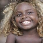The Melanesians; Dark Race With Long Blonde Hair.